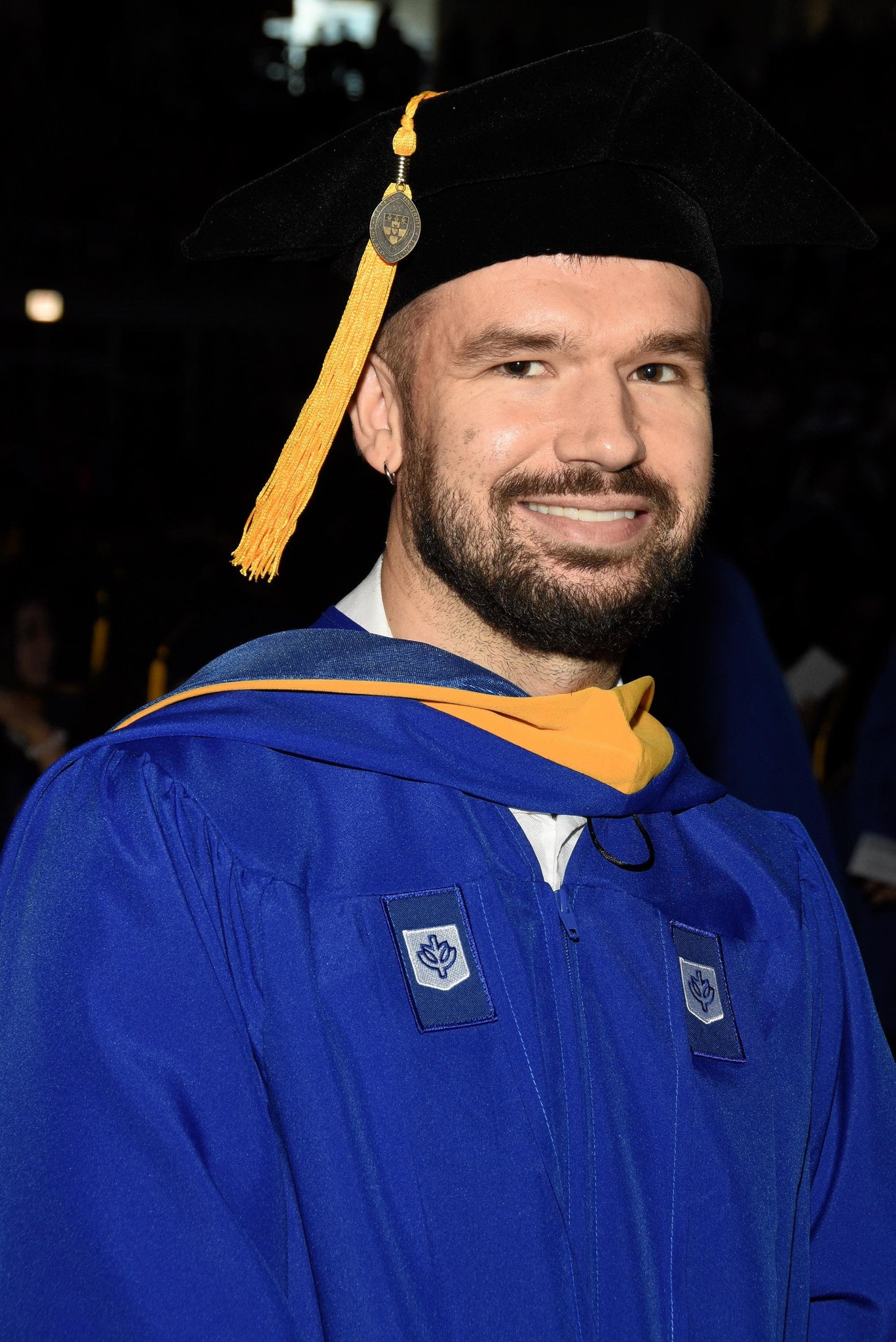 Jonathan Lindahl in his DePaul graduation cap and gown